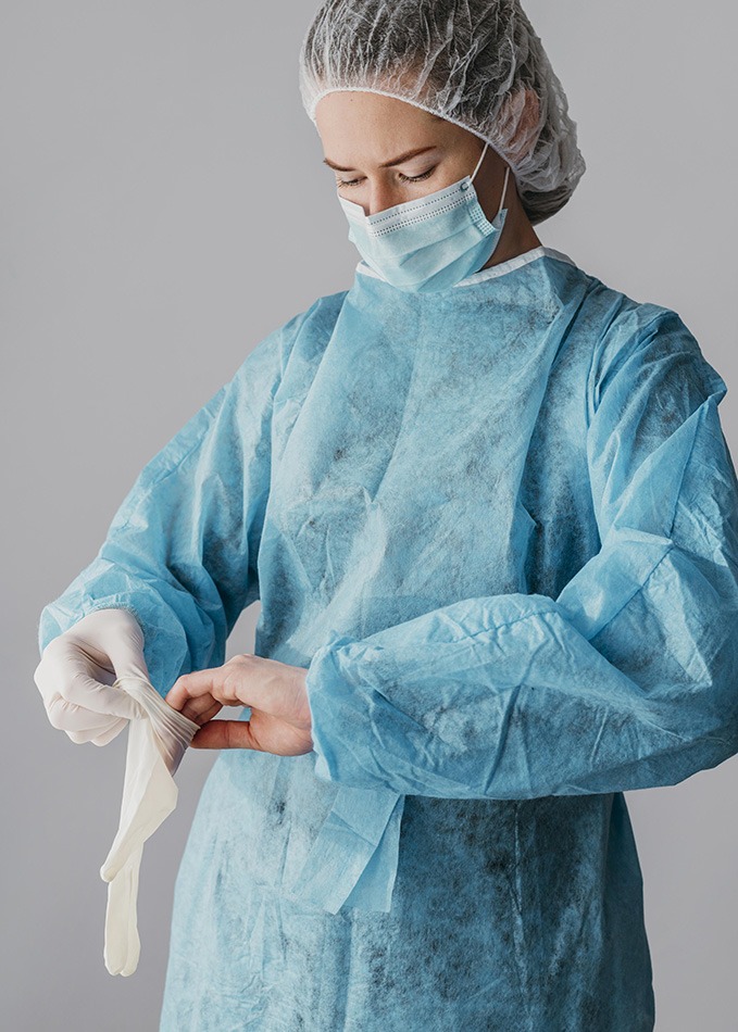 doctor-putting-surgical-gloves